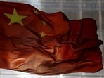 FILE PHOTO: China's national flag flutters at a business district in Beijing, October 29, 2015. REUTERS/Kim Kyung-Hoon/File Photo