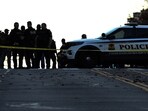 Law-enforcement officials visit the crime scene of a shooting in downtown Washington, DC, on November 26, 2025. Law-enforcement officials visit the crime scene of a shooting in downtown Washington, DC, on November 26, 2025.