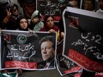 Pakistan Tehreek-e-Insaf (PTI) party supporters carry a poster of their leader and former Prime Minister Imran Khan, during a protest against in Karachi on November 21 Pakistan Tehreek-e-Insaf (PTI) party supporters carry a poster of their leader and former Prime Minister Imran Khan, during a protest against in Karachi on November 21