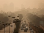Vehicles move along a road on a smoggy morning, as air pollution persists in Mumbai, November 27