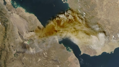 A satellite image shows ash rising from the eruption of the Hayli Gubbi volcano in Ethiopia on Sunday. (NASA handout via Reuters)