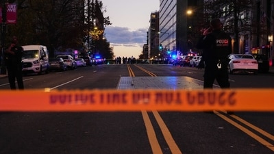 Law enforcement officers secure the scene of a shooting in Washington, DC, US, on Wednesday. (Bloomberg) Law enforcement officers secure the scene of a shooting in Washington, DC, US, on Wednesday. (Bloomberg)