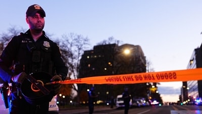 Law enforcement officers secure the scene of a shooting in Washington, DC, US, on Wednesday, Nov. 26, 2025. Two National Guardsmen were shot in downtown Washington near the White House and a suspect is in custody, officials said Wednesday. Photographer: Aaron Schwartz/Bloomberg (Bloomberg) Law enforcement officers secure the scene of a shooting in Washington, DC, US, on Wednesday, Nov. 26, 2025. Two National Guardsmen were shot in downtown Washington near the White House and a suspect is in custody, officials said Wednesday. Photographer: Aaron Schwartz/Bloomberg (Bloomberg)