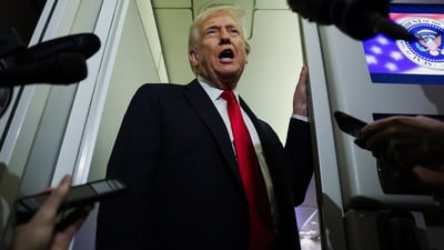 Donald Trump speaks to reporters aboard Air Force One during travel to Palm Beach, Florida (REUTERS)