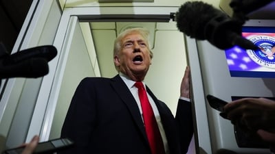 Donald Trump speaks to reporters aboard Air Force One during travel to Palm Beach, Florida (REUTERS)