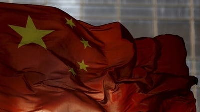 FILE PHOTO: China's national flag flutters at a business district in Beijing, October 29, 2015. REUTERS/Kim Kyung-Hoon/File Photo (REUTERS)