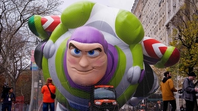 People walk near the new Buzz Lightyear balloon during Macy's Balloon Inflation 2025 (Getty Images via AFP) People walk near the new Buzz Lightyear balloon during Macy's Balloon Inflation 2025 (Getty Images via AFP)