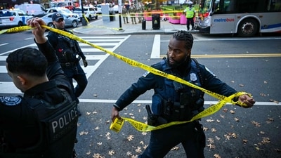 Police officers secure the area with crime scene tape after a shooting in downtown Washington, DC, on November 26, 2025. Two members of the National Guard were shot Wednesday just blocks from the White House, according to officials, as a spokesperson for Donald Trump said the president has been briefed on the "tragic situation." Police said they had detained a suspect (AFP) Police officers secure the area with crime scene tape after a shooting in downtown Washington, DC, on November 26, 2025. Two members of the National Guard were shot Wednesday just blocks from the White House, according to officials, as a spokesperson for Donald Trump said the president has been briefed on the "tragic situation." Police said they had detained a suspect (AFP)