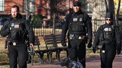 Secret Service uniformed division officers patrol in Lafayette Square across from the White House, in Washington, DC on November 27, 2025. (AFP)