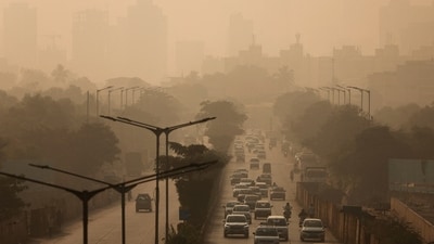 Vehicles move along a road on a smoggy morning, as air pollution persists in Mumbai, November 27 (REUTERS)