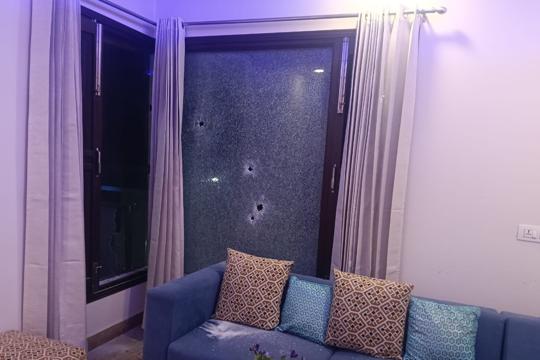 A window pane with bullet marks in the house of the Phagwara AAP leader on Thursday. (HT Photo) A window pane with bullet marks in the house of the Phagwara AAP leader on Thursday. (HT Photo)