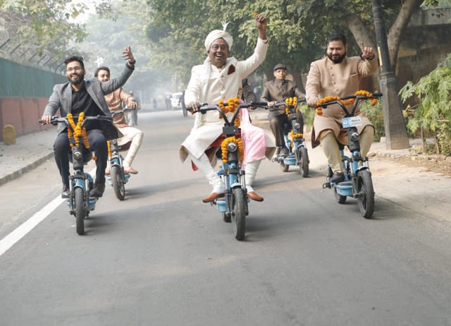 Balodi’s groom, Aditya, travelled to the venue on e-bikes with his baraat. Balodi’s groom, Aditya, travelled to the venue on e-bikes with his baraat.