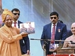 Chief minister Yogi Adityanath with Acharya Prasanna Sagar Maharaj during the Panchkalyanak Mahamahotsav, in Ghaziabad. (PTI PHOTO) Chief minister Yogi Adityanath with Acharya Prasanna Sagar Maharaj during the Panchkalyanak Mahamahotsav, in Ghaziabad. (PTI PHOTO)