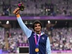 Neeraj Chopra celebrates on the podium during the medal ceremony for the men's javelin throw final athletics event during the 2022 Asian Games. Neeraj Chopra celebrates on the podium during the medal ceremony for the men's javelin throw final athletics event during the 2022 Asian Games.