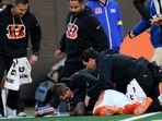 Cincinnati Bengals wide receiver Tee Higgins lies on the field after getting injured during the second half of the NFL game against the New England Patriots (AP Photo/Carolyn Kaster) Cincinnati Bengals wide receiver Tee Higgins lies on the field after getting injured during the second half of the NFL game against the New England Patriots (AP Photo/Carolyn Kaster)