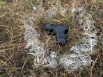 Pistol recovered from the gangster arrested in Batala after exchange of fire between him and cops. (HT Photo) Pistol recovered from the gangster arrested in Batala after exchange of fire between him and cops. (HT Photo)