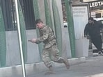 A National Guardsman and the suspect at the scene of Wednesday’s shooting in Washington, D.C.