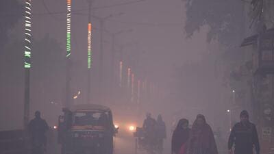 A dense layer of haze seen early in the morning on Basai Road in Gurugram on Friday. (Parveen Kumar/HT) A dense layer of haze seen early in the morning on Basai Road in Gurugram on Friday. (Parveen Kumar/HT)