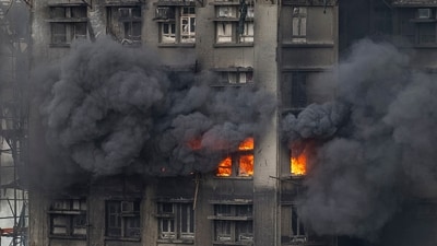 Hong Kong tower fire: The fire spread rapidly after construction netting and bamboo scaffolding surrounding the estate caught fire. (AP) Hong Kong tower fire: The fire spread rapidly after construction netting and bamboo scaffolding surrounding the estate caught fire. (AP)