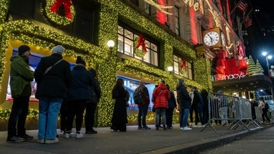 Shoppers wait in line outside of Macy's flagship store in Herald Square before opening on Black Friday in New York, US, on Friday, Nov. 28, 2025. Americans are planning to spend more this holiday season than last year, according to credit reporting firm TransUnion. (Bloomberg) Shoppers wait in line outside of Macy's flagship store in Herald Square before opening on Black Friday in New York, US, on Friday, Nov. 28, 2025. Americans are planning to spend more this holiday season than last year, according to credit reporting firm TransUnion. (Bloomberg)