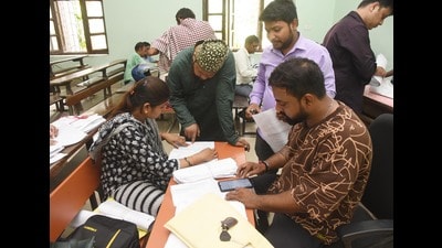 Booth Level Officer (BLO) verification documents of voters during the special intensive revision of electoral rolls (File) Booth Level Officer (BLO) verification documents of voters during the special intensive revision of electoral rolls (File)