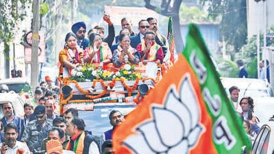 Delhi chief minister Rekha Gupta waves to voters at Ward 65 in Ashok Vihar, on Friday. (Vipin Kumar/HT Photo) Delhi chief minister Rekha Gupta waves to voters at Ward 65 in Ashok Vihar, on Friday. (Vipin Kumar/HT Photo)