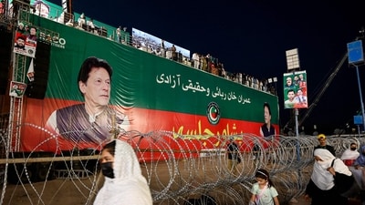 Supporters of Pakistan Tehreek-e-Insaf (PTI) party walk past a banner of their leader and jailed former Prime Minister Imran Khan during a protest demanding his release in Peshawar. (AFP) Supporters of Pakistan Tehreek-e-Insaf (PTI) party walk past a banner of their leader and jailed former Prime Minister Imran Khan during a protest demanding his release in Peshawar. (AFP)