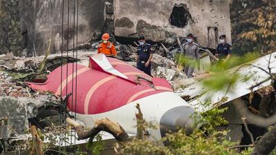 NDRF and security personnel at the site of the Air India plane crash, in Ahmedabad, Gujarat. (PTI) NDRF and security personnel at the site of the Air India plane crash, in Ahmedabad, Gujarat. (PTI)