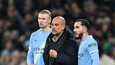 Manchester City manager Pep Guardiola prepares to substitute on Manchester City's Erling Haaland and Rayan Cherki against Bayer Leverkusen. (REUTERS)