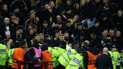 BSC Young Boys fans clash with police and stewards in the stands. (Action Images via Reuters)