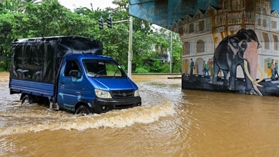 A vehicle moves through a flooded road after heavy rainfall in Kaduwela on the outskirts of Colombo on November 28, 2025. Sri Lanka deployed the military for relief and rescue operations. (AFP) A vehicle moves through a flooded road after heavy rainfall in Kaduwela on the outskirts of Colombo on November 28, 2025. Sri Lanka deployed the military for relief and rescue operations. (AFP)