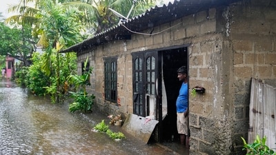 A man stands at the entrance to his home flooded by rainwater in Colombo, Sri Lanka, Friday, Nov. 28, 2025. (AP) A man stands at the entrance to his home flooded by rainwater in Colombo, Sri Lanka, Friday, Nov. 28, 2025. (AP)