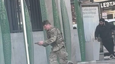 A National Guardsman and the suspect at the scene of Wednesday’s shooting in Washington, D.C. A National Guardsman and the suspect at the scene of Wednesday’s shooting in Washington, D.C.