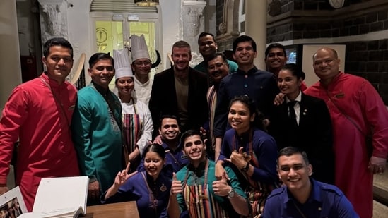 David Beckham with the hotel staff (https://www.instagram.com/davidbeckham/)