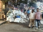 Garbage has been piling up outside Clover Center in Camp since mid-October after PCB stopped lifting waste from 550-shop complex over garbage collection fee dues. (HT)