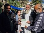 Kuldeep Kumar, who visited the family along with his daughter, offered a five-marla plot to the journalist's family in Jammu's Transport Nagar area.