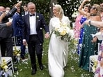 Australian Prime Minister Anthony Albanese married his partner Jodie Haydon in a private ceremony at The Lodge in Canberra on Saturday, becoming the first serving Australian prime minister to wed while in office in the 124-year history of the country's federal government. Picture shows Albanese and his new wife Jodie Haydon walk together during their wedding ceremony in Canberra on November 29, 2025.(AFP)