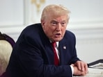 Trump speaks with members of the media following a call with military service members, on Thanksgiving