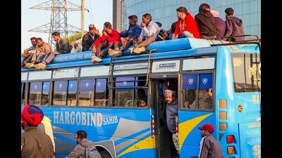 Commuters board a private bus, a day after a strike by PRTC contractual workers over detainment of their leaders by police, at a bus stand, in Patiala, on Saturday. (PTI) Commuters board a private bus, a day after a strike by PRTC contractual workers over detainment of their leaders by police, at a bus stand, in Patiala, on Saturday. (PTI)