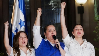 Ana Garcia, wife of the former president of Honduras, Juan Orlando Hernandez, speaks to the media after Donald Trump said he will grant a pardon to former Honduras President Hernandez. (REUTERS)