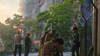 In this photo taken Wednesdaym Nov. 26, 2025 and released by William Li, fire fighters prepare to battle the deadly Wednesday fire at Wang Fuk Court, a residential estate in the Tai Po district of Hong Kong's New Territories (William Lim via AP) (AP) In this photo taken Wednesdaym Nov. 26, 2025 and released by William Li, fire fighters prepare to battle the deadly Wednesday fire at Wang Fuk Court, a residential estate in the Tai Po district of Hong Kong's New Territories (William Lim via AP) (AP)