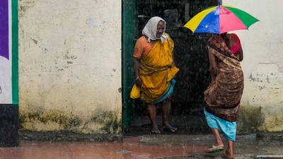 Cyclone Ditwah: Women rush for cover as rain lashes the city, in Chennai, Tuesday, Nov. 18, 2025. (PTI) Cyclone Ditwah: Women rush for cover as rain lashes the city, in Chennai, Tuesday, Nov. 18, 2025. (PTI)