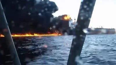 This video grab taken from images released by the Security service of Ukraine (SBU) on November 29, 2025, shows smoke rising from a cargo ship on fire in the Black Sea off the Turkish coast, amid the ongoing Russian-Ukrainian conflict. (AFP)