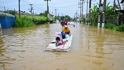 A man is seen pushing a makeshift raft along a flooded street in Ambatale on the outskirts of Colombo, Sri Lanka, on Saturday after Cyclone Ditwah unleashed torrential rains and powerful winds across the country, triggering widespread flooding and deadly landslides, especially in central and eastern hilly regions. The death toll climbed to 132, while 176 others remain unaccounted for. According to the Disaster Management Centre (DMC), the severe weather has damaged over 15,000 houses and forced nearly 78,000 people to take refuge in government-run relief camps, said a report by AFP. (AFP Photo) A man is seen pushing a makeshift raft along a flooded street in Ambatale on the outskirts of Colombo, Sri Lanka, on Saturday after Cyclone Ditwah unleashed torrential rains and powerful winds across the country, triggering widespread flooding and deadly landslides, especially in central and eastern hilly regions. The death toll climbed to 132, while 176 others remain unaccounted for. According to the Disaster Management Centre (DMC), the severe weather has damaged over 15,000 houses and forced nearly 78,000 people to take refuge in government-run relief camps, said a report by AFP. (AFP Photo)