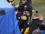 Pittsburgh Steelers quarterback Aaron Rodgers (8) walks to the sideline to be checked out for injury Pittsburgh Steelers quarterback Aaron Rodgers (8) walks to the sideline to be checked out for injury