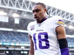 Justin Jefferson #18 of the Minnesota Vikings looks on prior to a game against the Seattle Seahawks at Lumen Field on November 30, 2025 in Seattle, Washington. Justin Jefferson #18 of the Minnesota Vikings looks on prior to a game against the Seattle Seahawks at Lumen Field on November 30, 2025 in Seattle, Washington.