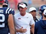 Hoach Lane Kiffin of the Mississippi Rebels talks to his offense during a timeout in the third quarter of the game against the Citadel Bulldogs 