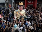 Filipino activists destroy an effigy depicting Philippine President Ferdinand "Bongbong" Marcos Jr and Vice President Sara Duterte during an anti-corruption protest.