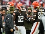 Cleveland Browns quarterback Shedeur Sanders (12) is helped off the field by tight end David Njoku (85) and trainers Cleveland Browns quarterback Shedeur Sanders (12) is helped off the field by tight end David Njoku (85) and trainers