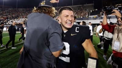 Diego Pavia #2 of the Vanderbilt Commodores and comedian Theo Vonn celebrate after an overtime victory against the Auburn Tigers (Getty Images via AFP) Diego Pavia #2 of the Vanderbilt Commodores and comedian Theo Vonn celebrate after an overtime victory against the Auburn Tigers (Getty Images via AFP)